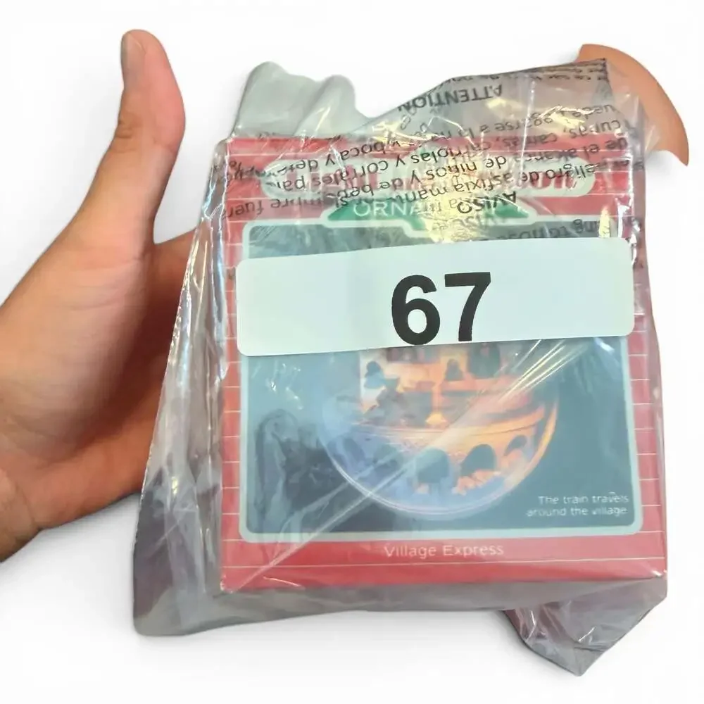 1986 Hallmark Keepsake Light and Motion Village Express Ornament